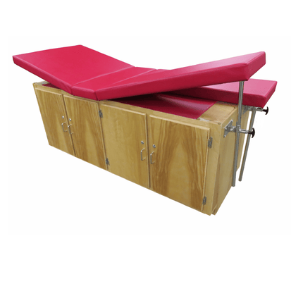 Close-up of Bailey Model 4311 Treatment Table cabinetry detail with wire fingerpulls and upholstery